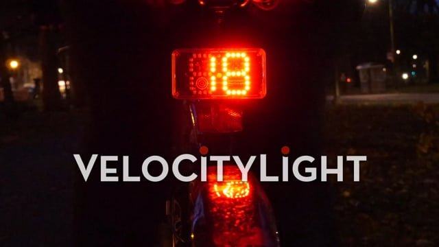VeloCityLight speed display illuminated on the back of a bicycle at night